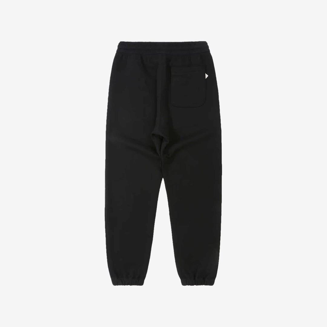 Un-Useless 170414 SWKNIT inlay knit sweatpants made in Japan tapered silhouette navy back view 