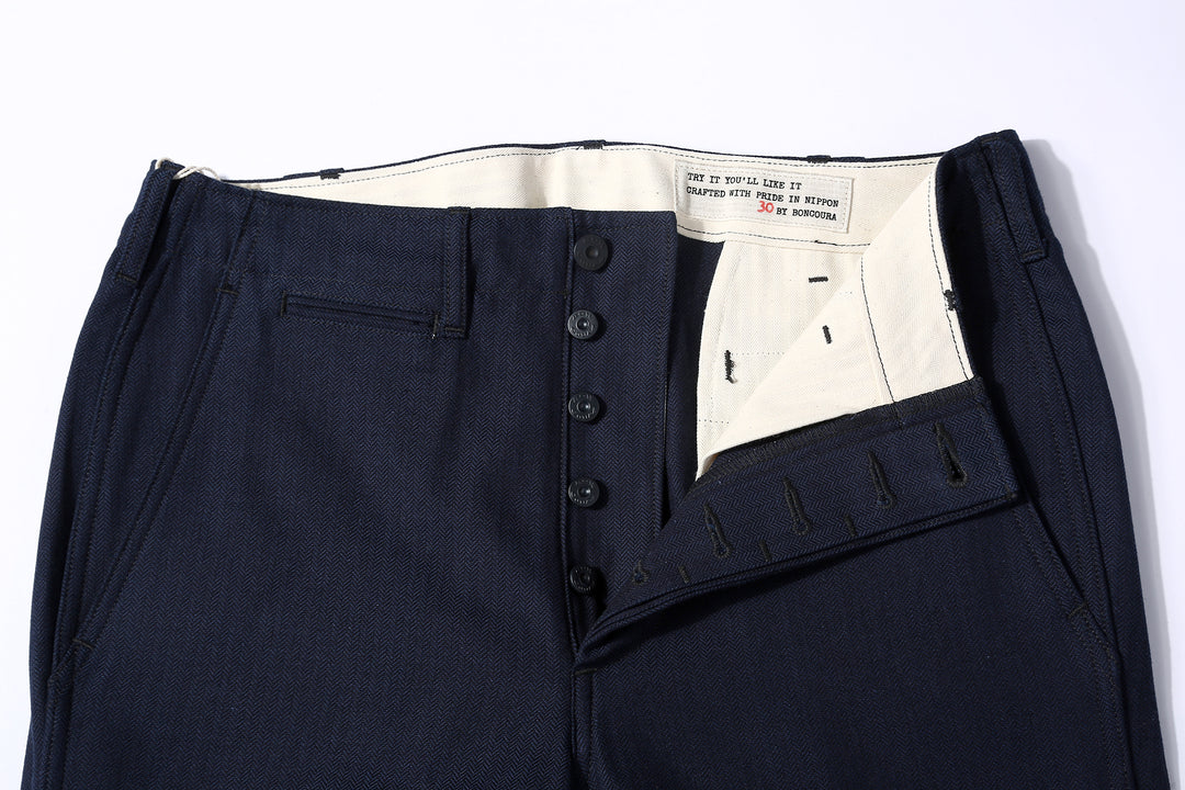 Boncoura 41 indigo herringbone trousers front view buttons detail