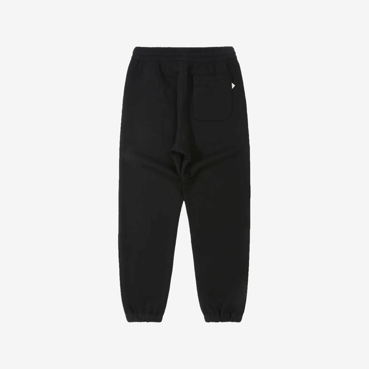 Un-Useless 170414 SWKNIT inlay knit sweatpants made in Japan tapered silhouette black back view 
