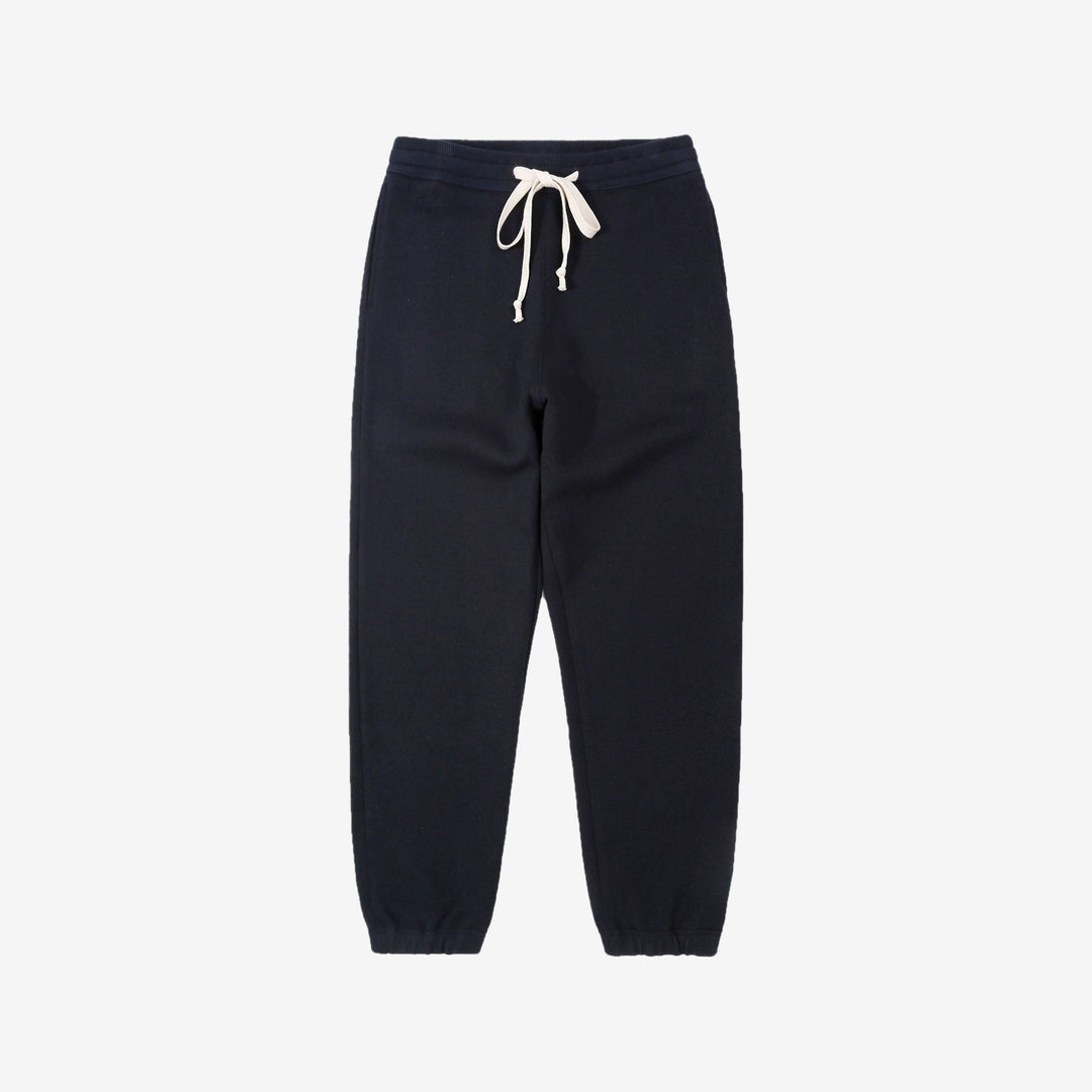 Un-Useless 170414 SWKNIT inlay knit sweatpants made in Japan tapered silhouette navy front view 