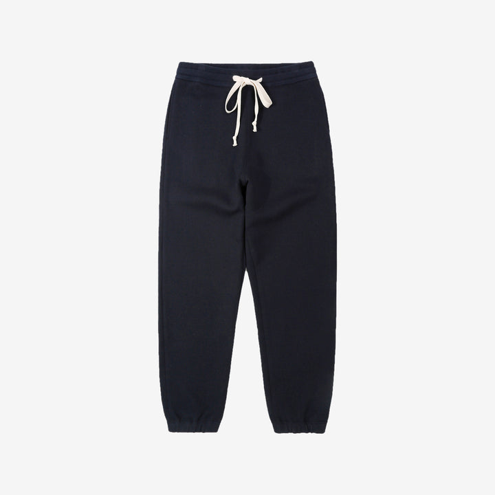 Un-Useless 170414 SWKNIT inlay knit sweatpants made in Japan tapered silhouette navy front view 