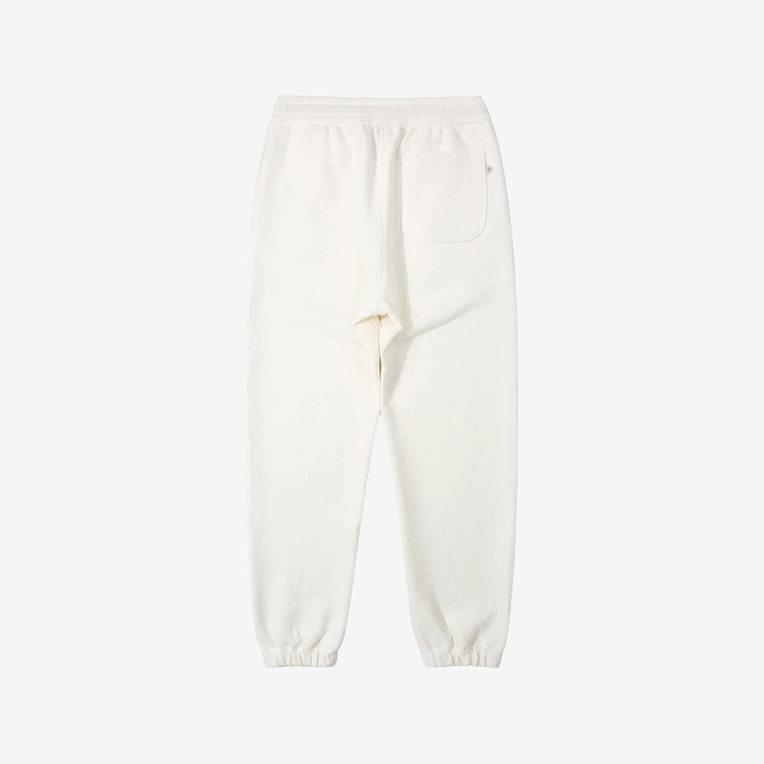 Un-Useless 170414 SWKNIT inlay knit sweatpants made in Japan tapered silhouette white back view 